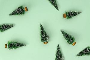 festive new year background with scattered christmas trees. Pattern design for backdrop. Minimal style. photo