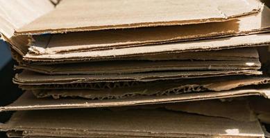 background of paper cardboard textures piled ready to recycle. photo