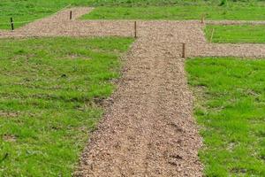 marking garden paths on the construction site. Countryside house building photo