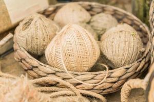 many skeins in a basket made of hemp. Fiber production. photo
