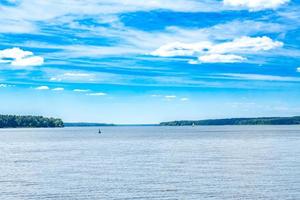 the Volga River in the middle course. View from the boat. Summer river landscape photo