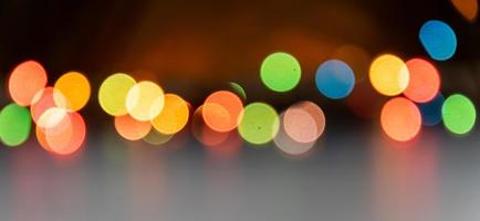 Festive multicolored bokeh background. Blurred lights of led garland. Copy space photo