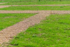 marking garden paths on the construction site. Countryside house building photo