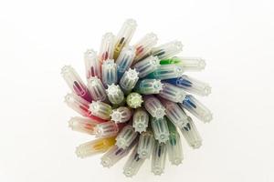 Set of felt tip pens rolled on a white background. Top view. Art and school creative concept photo