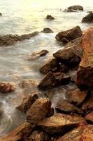 Beautiful seascape. Sea and rock at the sunset photo