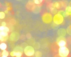 Golden bokeh light illustration with sparkle and glitter, blurred light background, Christmas and New Year background concept. photo