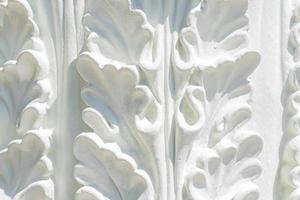 Gypsum stucco moulding plasterwork abstract background. White gypsum abstract background. Decorative stucco element concept of fletwork photo