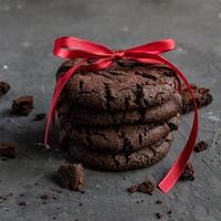 Tall stack of soft homemade chocolate chip cookies with a bite mark photo