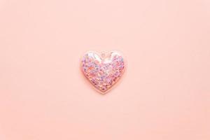 Valentine's day concept with pink heart on light background, top view, copy space. photo