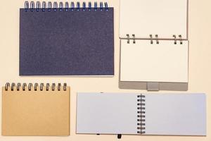 plenty of notebooks made from recycled paper. Stationery mock up template for your design. View from above. Flat lay photo