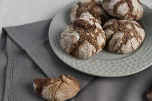 biscuits with chocolate cracks. Homemade tasty cookies in grey bowl on a table. photo