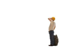 Miniature worker isolated on white background with clipping path photo