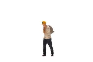 Miniature worker isolated on white background with clipping path photo