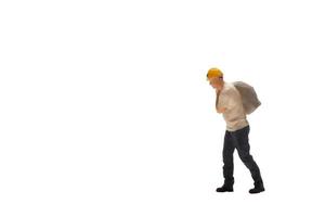 Miniature worker isolated on white background with clipping path photo