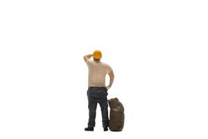 Miniature worker isolated on white background with clipping path photo