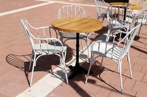 A chair in a city park on the seashore. photo