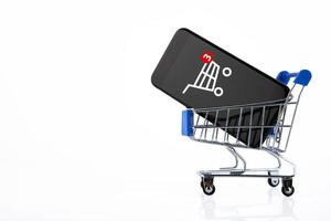 shopping cart, supermarket trolley, e-commerce, digital commerce, retail on a white background. Copy space. photo
