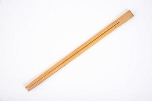 Wooden chopsticks on a white background. Copy space. photo