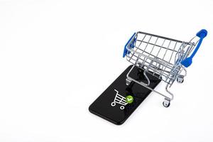shopping cart, supermarket trolley, e-commerce, digital commerce, retail on a white background. Copy space. photo