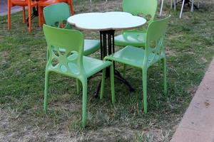 A chair in a city park on the seashore. photo