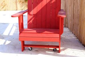 A chair in a city park on the seashore. photo