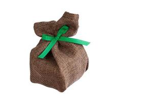 sack gift bag with ribbon bow on white background photo