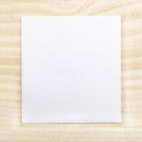 Blank paper on wood background photo