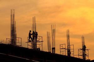 silhouette of building construction on evening photo