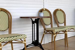 A chair in a city park on the seashore. photo