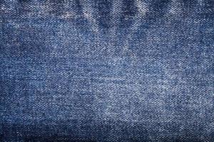 Texture of blue jeans background photo