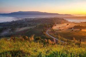 Misty morning sunrise in Khao Takhian Ngo View Point at Khao-kho Phetchabun,Thailand photo