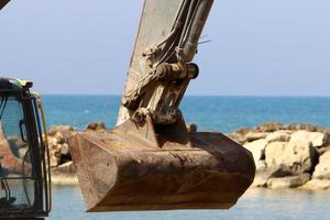 Nahariya Israel March 4, 2020. A large excavator is working at a construction site. photo