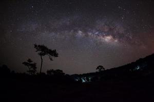 Milky way and silhouette of tree, Long exposure photograph, with grain photo