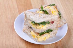 sandwich on wood table photo