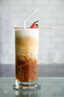 iced coffee latte with strawberry in shop photo