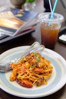 spaghetti seafood tomato sauce on wood table photo