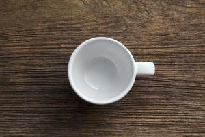 Empty coffee cup on old wooden photo