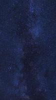 Starry night sky, Milky way galaxy with stars and space dust in the universe, Long exposure photograph, with grain. photo