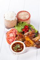 Grilled Chicken Wings with Red Spicy Sauce and Sticky Rice photo