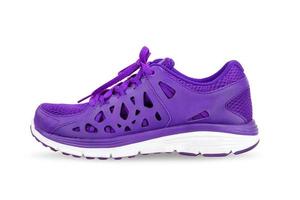 violet sport running shoes isolated on white background photo