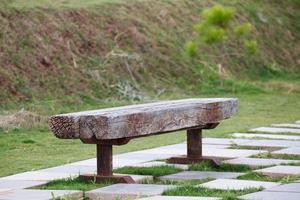 wooden park bench in garden photo