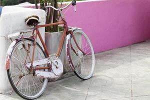 old bicycle on wall photo