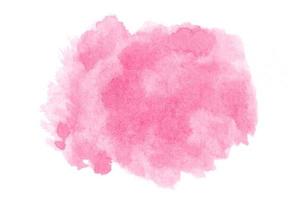 Abstract pink watercolor on white background.The color splashing on the paper.It is a hand drawn. photo