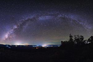 Starry night sky, Milky way galaxy with stars and space dust in the universe, Long exposure photograph, with grain. photo