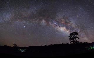 Panorama silhouette of Tree with cloud and Milky Way. Long exposure photograph. photo