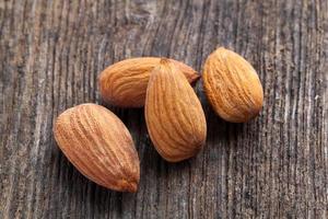 almonds on wood background photo