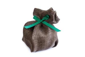 sack gift bag with ribbon bow on white background photo