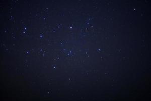 Starry night sky and milky way galaxy with stars and space dust in the universe photo