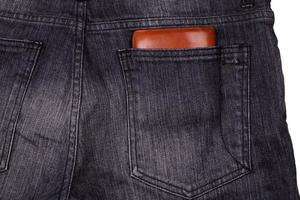 Wallet in jeans back pocket photo