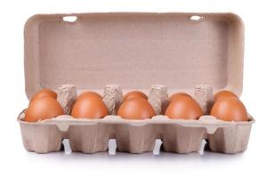 Ten brown eggs in a carton package photo